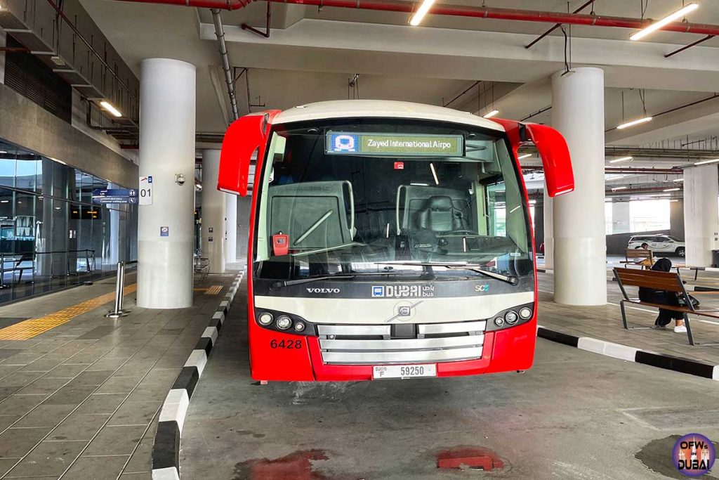 Beatiful red and white RTA bus E102 from Al-Jafliya Metro Station Dubai to Abu Dhabi Zayed International Airport