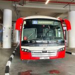 Beatiful red and white RTA bus E102 from Al-Jafliya Metro Station Dubai to Abu Dhabi Zayed International Airport